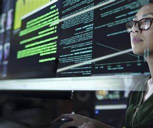 Woman working on a computer screen